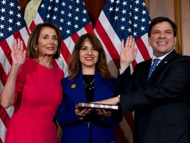 House Speaker Nancy Pelosi of Calif., administers the House oath of office to Rep. Vicente Gonzalez, D-Texas., during a ceremonial swearing-in on Capitol Hill in Washington, Thursday, Jan. 3, 2019, during the opening session of the 116th Congress. (AP Photo/Jose Luis Magana)"