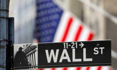 A street sign for Wall Street outside the New York Stock Exchange in New York City, N.Y., on July 19, 2021. (Andrew Kelly/Reuters)