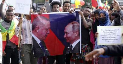 © Provided by CNBC ADDIS ABABA, Ethiopia - August 8, 2020: Ethiopians hold up a poster of Russian President Vladimir Putin and Turkish President Recep Tayyip Erdogan during a pro-government gathering condemning the rebel Tigray People's Liberation Front (TPLF)