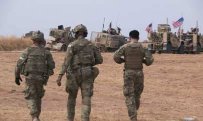 An American military convoy stops near the town of Tel Tamr, north Syria on Oct. 20, 2019. (AP Photo/Baderkhan Ahmad)