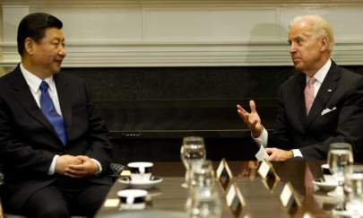 US Vice President Joe Biden (R) meets with Chinese vice leader Xi Jinping in the Roosevelt Room at the White House in Washington, DC, on Feb. 14, 2012. (Jim Watson/AFP via Getty Images)