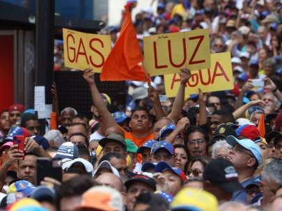 Participants in the march organized by the opposition pass the streets of the El Rosal neighborhood of Caracas, Venezuela, on November 16, 2019. (Edilzon Gamez/Getty Images)