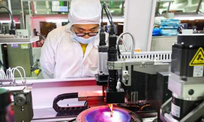 An employee makes chips at a factory of Jiejie Semiconductor Company in Nantong, in eastern China's Jiangsu Province on March 17, 2021. (STR/AFP via Getty Images)