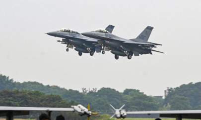 Two armed US-made F-16V fighters fly over at an air force base in Chiayi, southern Taiwan on January 5, 2022. (Sam Yeh/AFP via Getty Images)