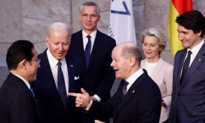 Japan's Prime Minister Fumio Kishida, U.S. President Joe Biden, and Germany's Chancellor Olaf Scholz speak next to NATO Secretary General Jens Stoltenberg, European Commission President Ursula von der Leyen, and Canada's Prime Minister Justin Trudeau are seen in Brussels, Belgium, on on March 24, 2022. (Henry Nicholls/ Pool/Getty Images)