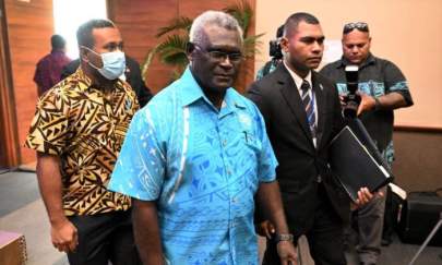 Prime minister of the Solomon Island Manasseh Sogavare (C) arrives for the opening remarks of Pacific Islands Forum (PIF) in Suva on July 12, 2022 (William West/AFP via Getty Images)