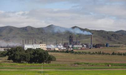 A photo taken on August 20, 2012 shows a general view of a rare earth refinery north of the inner Mongolian city of Baotou. On the edge of the Chinese city of Baotou, a 10-square-kilometre lake is blackened by pollution from factories processing rare earths, elements essential for the production of mobile phones and computers. (Ed Jones/AFP via Getty Images)