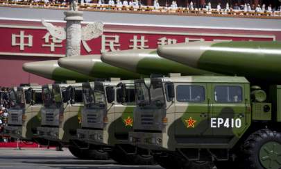 Military vehicles carrying DF-26 ballistic missiles drive past the Tiananmen Gate during a military parade in Beijing, on Sept. 3, 2015. (Andy Wong/Pool /Getty Images)