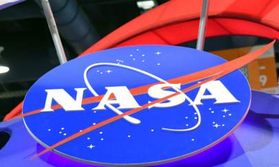 The NASA logo is displayed at the agency's booth at the Las Vegas Convention Center in Las Vegas, Nev., on Jan. 11, 2018. (Ethan Miller/Getty Images)