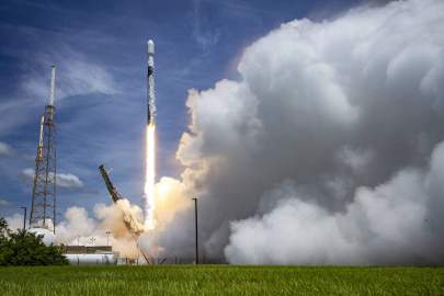 A SpaceX Falcon 9 launch vehicle clears the lightning towers around Space Launch Complex-40 at Cape Canaveral Space Force Station after lifting off June 17, carrying the fifth Lockheed Martin-built Global Positioning Systems III Space Vehicle for the U.S. Space Force. (SpaceX) 