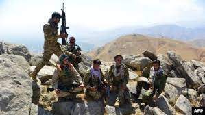 FILE - Afghan resistance movement and anti-Taliban forces take a break as they patrol on a hilltop in the Darband area of Anaba district, in Afghanistan's Panjshir province, Sept. 1, 2021.