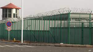 AP - A guard tower and barbed wire fences are seen around a facility in the Kunshan Industrial Park in Artux in western China's Xinjiang region. This is one of a growing number of internment camps in the Xinjiang region