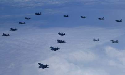 In this photo provided by South Korea Defense Ministry, U.S. and South Korea Air Force fighter jets including South Korea's F-35A stealth fighters – and U.S. F-16 fighter jets, fly in formation during a joint drill on June, 7, 2022. (South Korea Defense Ministry via AP)