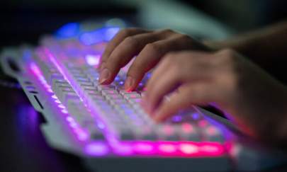 A man using a computer in Dongguan, Guangdong Province, China, on Aug. 4, 2020. (Nicolas Asfouri/AFP via Getty Images)