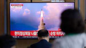 AP - People watch a news program reporting about North Korea's missile launch with a file image, at a train station in Seoul, South Korea, May 25, 2022. Hours after U.S. President Joe Biden left Asia, North Korea launched three ballistic missiles toward the sea, its neighbors said.