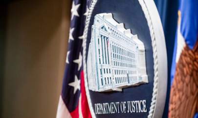 The U.S. Department of Justice seal on the stage at the U.S. Department of Justice in Washington, on Dec. 5, 2019. (Samuel Corum/Getty Images)