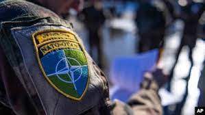 AP - FILE - In this photo provided by the French army Friday March 18, 2022, a French soldier from the 7th Mountain Battalion wears a NATO badge at Amari air base, Estonia, Thursday, March 17, 2022.