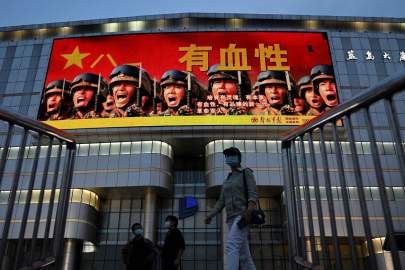 An image on a screen in Beijing encouraged people to have courage in May. PHOTO: NOEL CELIS/AGENCE FRANCE-PRESSE/GETTY IMAGES