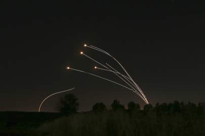 FILE - In this May 4, 2019 file photo, Israeli air defense system Iron Dome takes out rockets fired from Gaza near Sderot, Israel. (AP Photo/Ariel Schalit, File)  