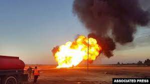 Associated Press - FILE - Flames rise from a gas line explosion outside Damascus, Syria, Aug. 24, 2020. ISIS on Sept. 18, 2021, claimed responsibility for an attack on a gas pipeline southeast of the Syrian capital that led to power outages in and around the city.