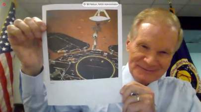 NASA Administrator Bill Nelson holds up a photo of China's Zhurong Mars rover during a House hearing on May 19, 2021. (Image credit: NASA TV)