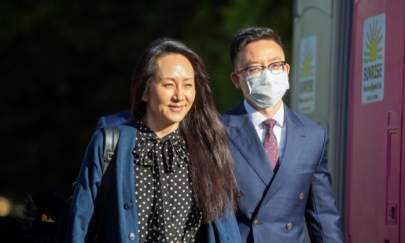 Huawei Technologies Chief Financial Officer Meng Wanzhou leaves her home to attend a court hearing in Vancouver, British Columbia, Canada on Sept. 24, 2021. (Taehoon Kim/Reuters)