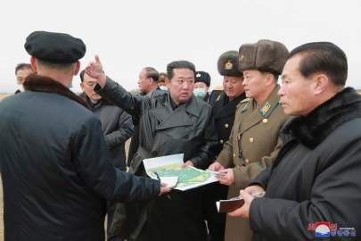 In this undated photo provided by the North Korean government, its leader Kim Jong Un, center, inspects an area planned for a vegetable greenhouse farm in the Ryonpho area of Hamju county, South Hamgyong province, northeast of Pyongyang, North Korea. Independent journalists were not given access to cover the event depicted in this image distributed by the North Korean government. The content of this image is as provided and cannot be independently verified. Korean language watermark on image as provided by source reads: "KCNA" which is the abbreviation for Korean Central News Agency. (Korean Central News Agency/Korea News Service via AP)