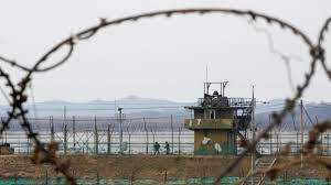 South Korean army soldiers patrol along the barbed-wire fence in Paju, South Korea, near the border with North Korea, on Jan. 5, 2022