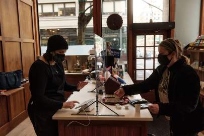 Shoppers checking out in a shop