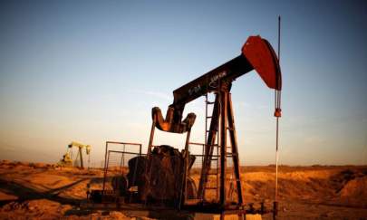 Pump Jacks are seen at sunrise near Bakersfield, Calif., on Oct. 14, 2014. (Lucy Nicholson/Reuters)