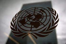  Reuters/Carlo Allegri FILE PHOTO: The United Nations headquarters building is pictured though a window with the UN logo in the foreground in the Manhattan borough of New York