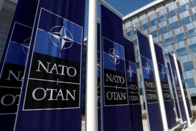 FILE PHOTO: Banners displaying the NATO logo are placed at the entrance of NATO headquarters during the move there, in Brussels, Belgium April 19, 2018. REUTERS/Yves Herman/File Photo