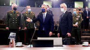 NATO Secretary General Jens Stoltenberg, center, and Russia's Deputy Foreign Minister Alexander Grushko, fourth right, arrive for the NATO-Russia Council at NATO headquarters, in Brussels, Jan. 12, 2022.