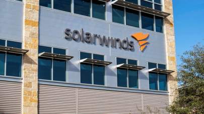 Sergio Flores/Reuters, FILE In this Dec. 18, 2020, file photo, the SolarWinds logo is seen outside its headquarters in Austin, Texas.