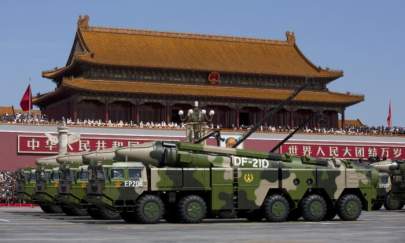 Chinese military vehicles, carrying DF-21D anti-ship ballistic missiles, drive past Tiananmen Square during a military parade in Beijing on Sept. 3, 2015. (Andy Wong/Pool/Getty Images)